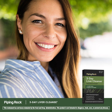 Smiling young woman holding a 3-Day Liver Cleanse box.