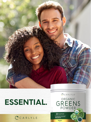 Young man and woman smiling while holding Carlyle Organic Greens Powder.