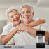 An older couple hugging and laughing on a couch, next to a bottle of Adult 50+ Multi vitamins.