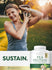 Woman smiling while exercising with a kettlebell, next to a Pea Protein Powder.
