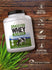 Grass Fed Whey bottle with icons indicating gluten, wheat, soy free, vegetarian, non-GMO, no artificial ingredients.