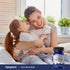 A mother and daughter hug and smile, holding a Kid's Melatonin bottle.