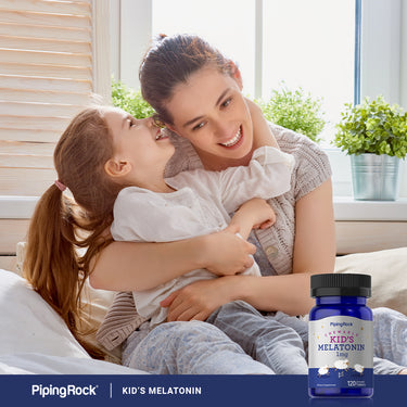 A mother and daughter hug and smile, holding a Kid's Melatonin bottle.