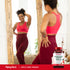 Young adult woman smiling in a mirror, wearing athletic wear, with a bottle of Apple Cider Vinegar 1800mg.