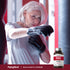 An older woman boxing while holding a NAC supplement bottle in a lively lifestyle setting.