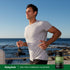 Adult jogging along a rocky coastline with Piping Rock Milk Thistle, Dandelion & Yellow Dock supplement bottle nearby.