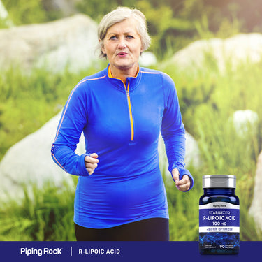 An older woman jogging outdoors with a bottle of R-Lipoic Acid beside her, promoting health and fitness.