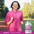 Middle-aged woman jogging outdoors next to a Mega Multi for Women supplement bottle.