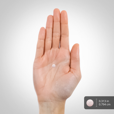 A small, round, speckled tablet measuring 0.313 inches or 0.794 cm in diameter.