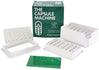 The Capsule Machine Size 00 kit in a green box stating 'THE CAPSULE MACHINE', with white capsule filling plates and a green tamping tool.