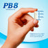 A hand holding a PB8 Probiotic capsule, measuring 3/4 inch long.