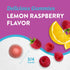 Lemon Raspberry magnesium gummy, 3/4 inches in size, next to fresh raspberries and lemon slices.