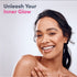 Young woman smiling, holding a sign that says 'Unleash Your Inner Glow', promoting Hyaluronic Acid.