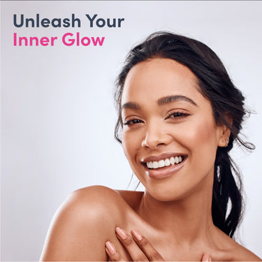 Young woman smiling, holding a sign that says 'Unleash Your Inner Glow', promoting Hyaluronic Acid.