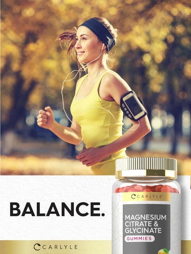 A young woman jogging outdoors while holding a bottle of Magnesium Gummies.