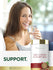 Young woman smiling while holding a water glass next to a Tart Cherry & Celery Seed supplement bottle.