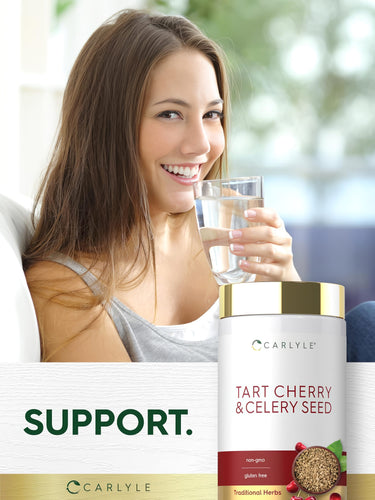 Young woman smiling while holding a water glass next to a Tart Cherry & Celery Seed supplement bottle.