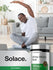 A young adult male stretches on a yoga mat and smiles, next to a bottle of Horbaach White Willow Bark.