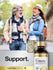 Older couple laughing and holding hands while walking outdoors next to a Doctor's Way Liquid Probiotic bottle.