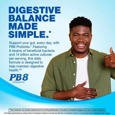 Young Black man smiling, giving a thumbs up, and holding his stomach with PB8 Probiotic in hand.