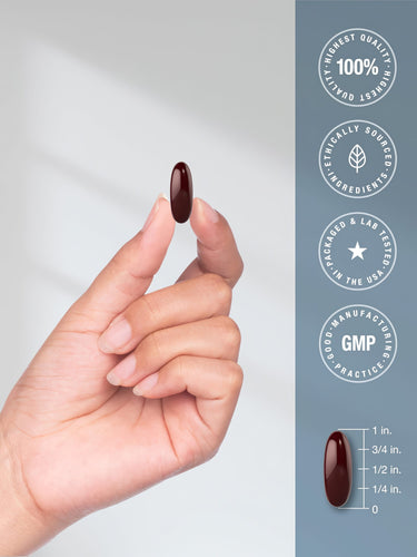 A 1-inch dark red Magnesium Citrate 850mg softgel held in a hand.