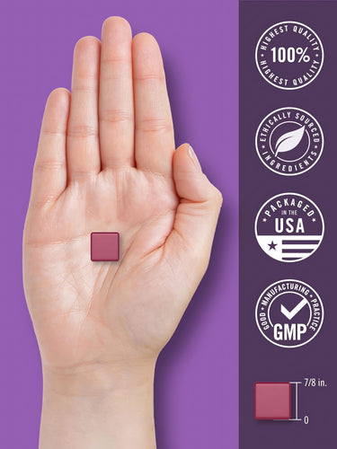 A 7/8 inch wide square melatonin with magnesium chew held between fingers.