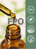 Dropper dispensing golden liquid into amber bottle with quality badges stating Finest Quality 100%, Ethically Sourced Ingredients, Packaged & Lab Tested USA