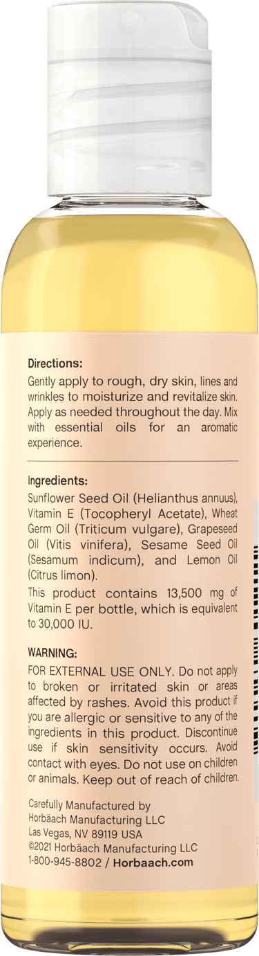 Back label of Vitamin E Oil bottle showing Directions, Ingredients, Warning, and manufacturer information.