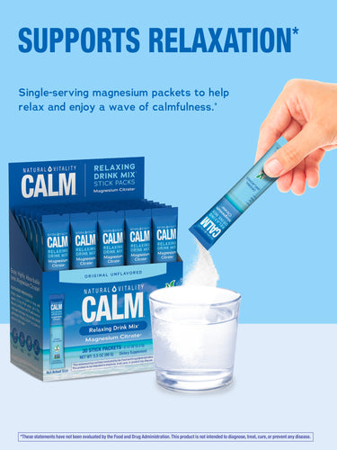 Adult hand pours NV Calm Relaxing Drink Mix powder into water, with the product's display box in view.