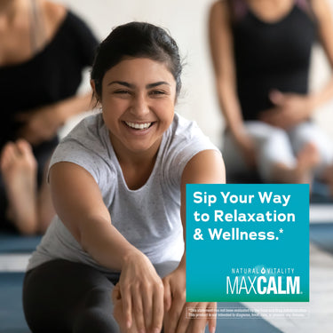 Young adult woman smiling in a yoga pose, with Natural Vitality Max Calm product overlay.