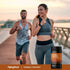 Two adults jogging on a waterfront path, with a Piping Rock Turmeric Curcumin Complex 800 mg bottle nearby