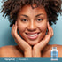 Adult smiling with hands resting against the face, with a Piping Rock Grass-Fed Peptides Collagen + C Types I & III 6000 mg bottle shown in the lower right corner.