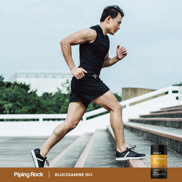 A young man runs up stairs next to a Glucosamine bottle.
