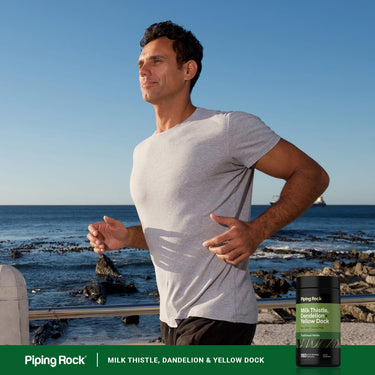 Adult jogging along a rocky coastline with Piping Rock Milk Thistle, Dandelion & Yellow Dock supplement bottle nearby.