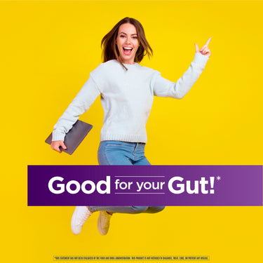 Young woman jumping joyfully while holding a laptop, promoting Ult Flora Saccharomyces Boulardii.