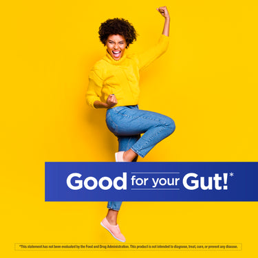 Young woman in yellow sweater and jeans cheers excitedly with text 'Good for your Gut!'. Daily Balance Probiotic.