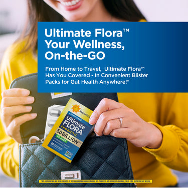 Young adult woman putting an Ultimate Flora Probiotic 50 Billion GO PACK into her black quilted purse.