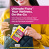 A young woman smiles as she places an Ultimate Flora Probiotic Go Pack into her black handbag.