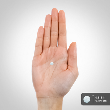 A hand holds a light blue tablet measuring 0.313 inches (0.794 cm).