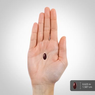 A dark softgel capsule, size 0.625 inches (1.587 cm).