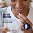 A young woman smiles, holding a white capsule and a glass of water, preparing to take Calm Sleep capsules.