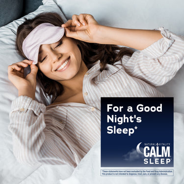 Young woman smiling in bed, adjusting a pink sleep mask, with a Calm Sleep graphic overlay.